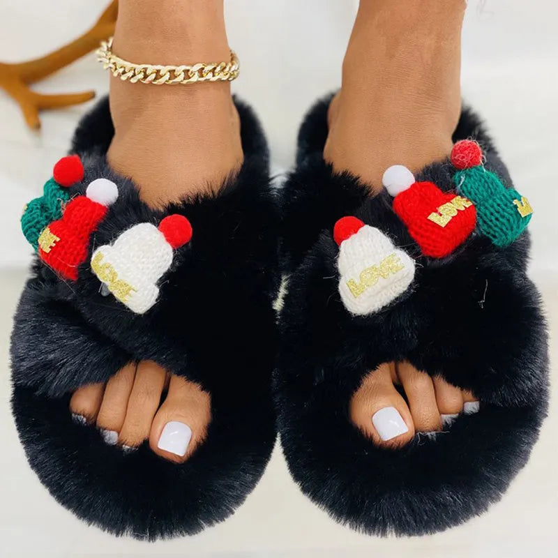 Women's Christmas hat slippers in faux plush with a rubber sole.