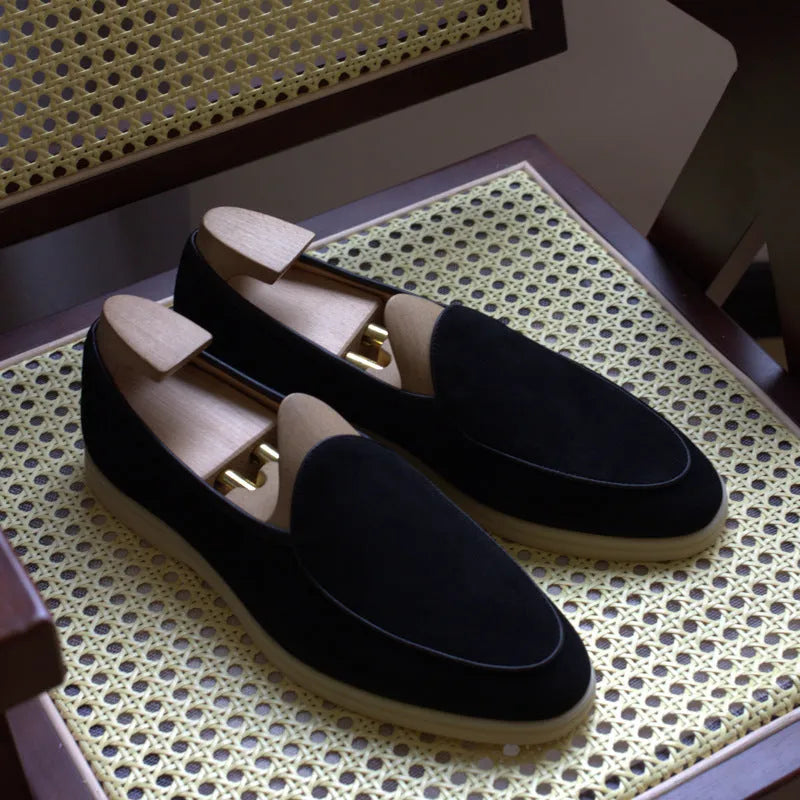 Men's brown genuine leather loafers with a TPR sole on a white background.