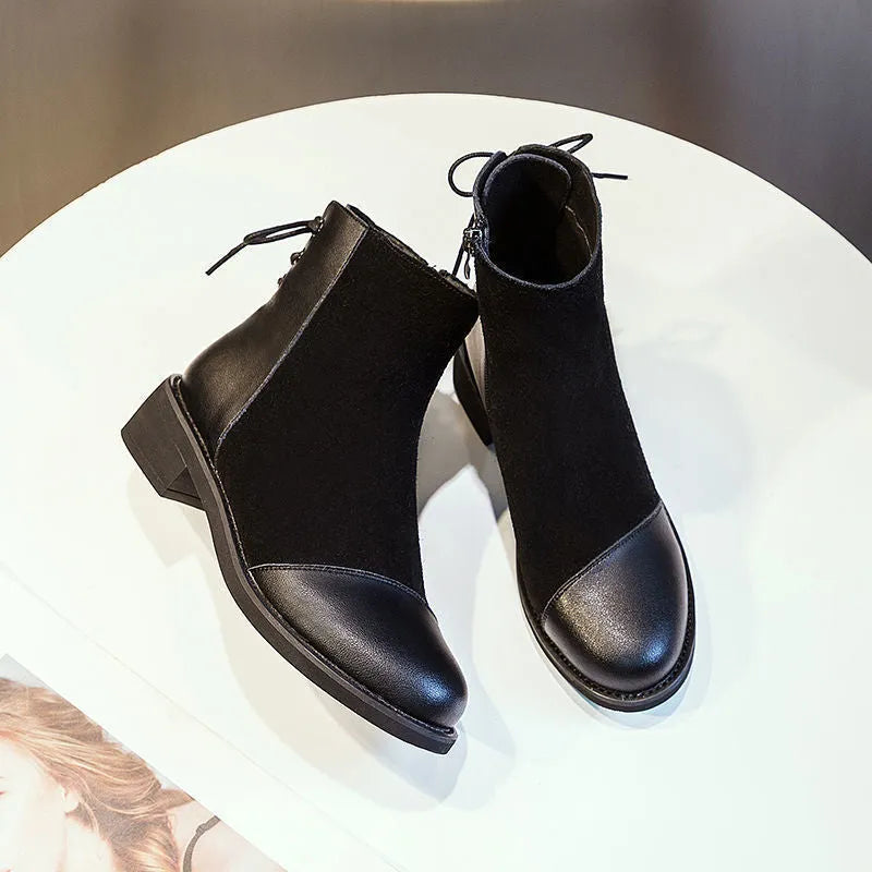 Black women's knee-high soft leather martin boots with side zip and bow detail.