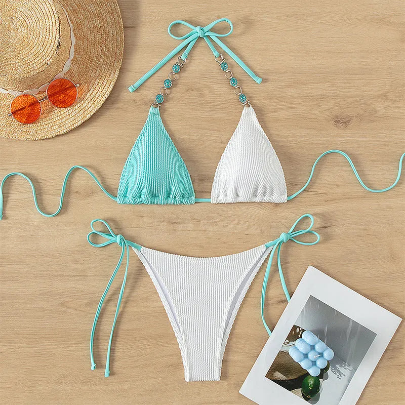 Women's colour matching two-piece swimsuit with lace-up front closure and pearl chain decoration.