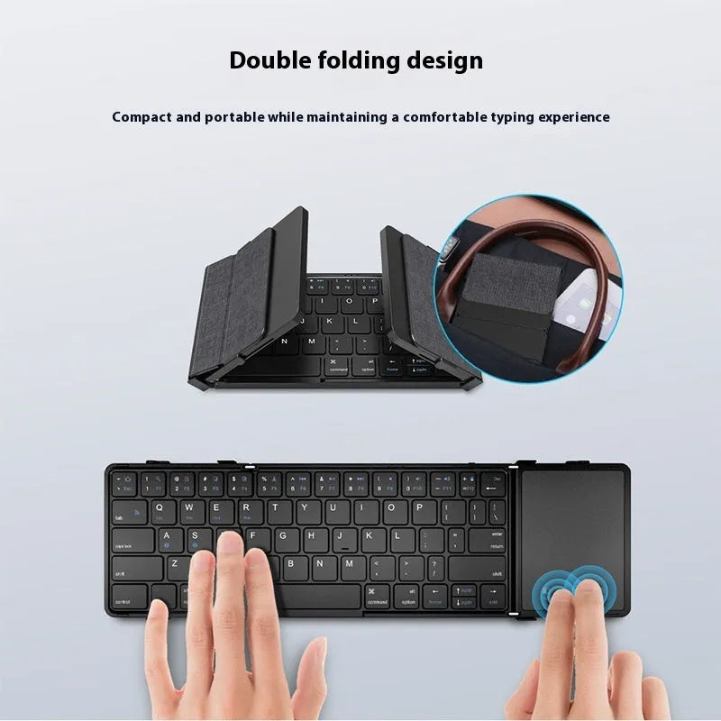 Black folding Bluetooth keyboard with touchpad unfolded showing full keyboard and touchpad surface