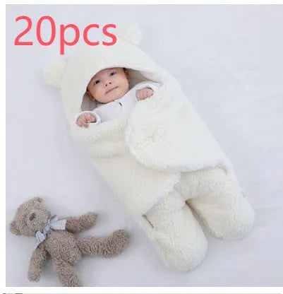 Cotton blend quilted baby sleeping bag wrapper in light blue, shown laid flat.