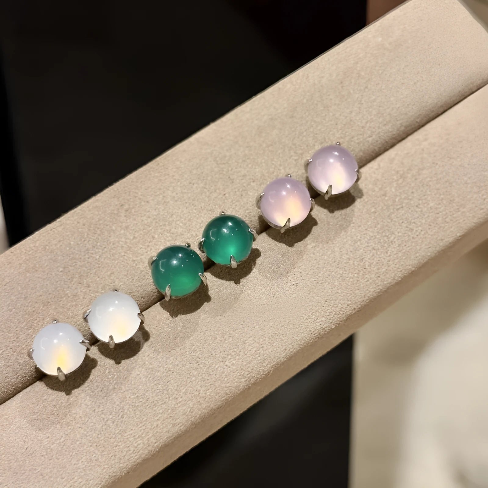 Round geometric chalcedony earrings with four-claw settings in three colour variations