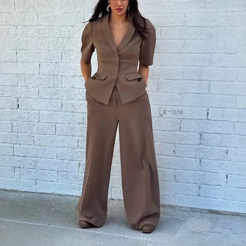 Brown slim fit two-piece suit with long sleeves and matching trousers on a hanger.