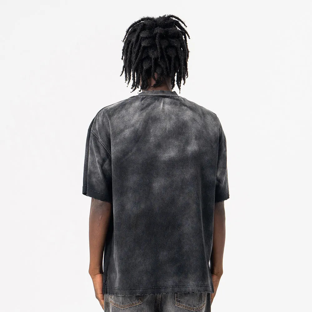Black men's loose-fit cotton t-shirt with a letter print and drop-shoulder sleeves.