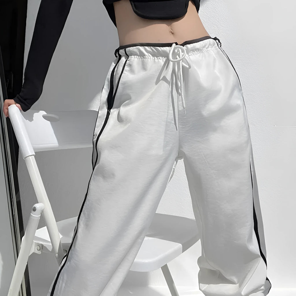 Women's slim-fit drape trousers in thin fabric with low waist and straight leg
