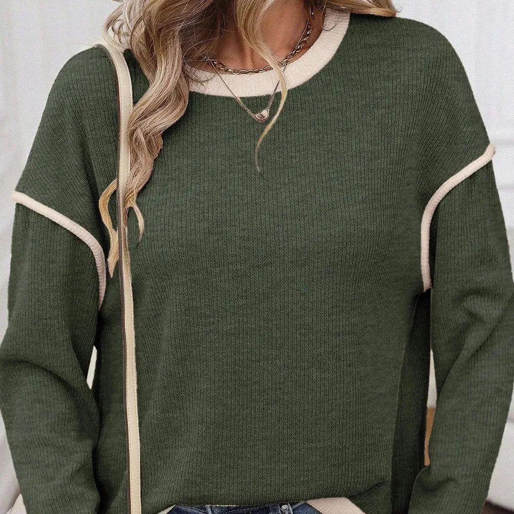 Women's beige knit top with four leaf clover pattern, contrast trim, and drop shoulder loose fit