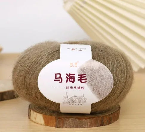 Single ball of mohair yarn in various colours for hand-woven DIY scarf knitting projects