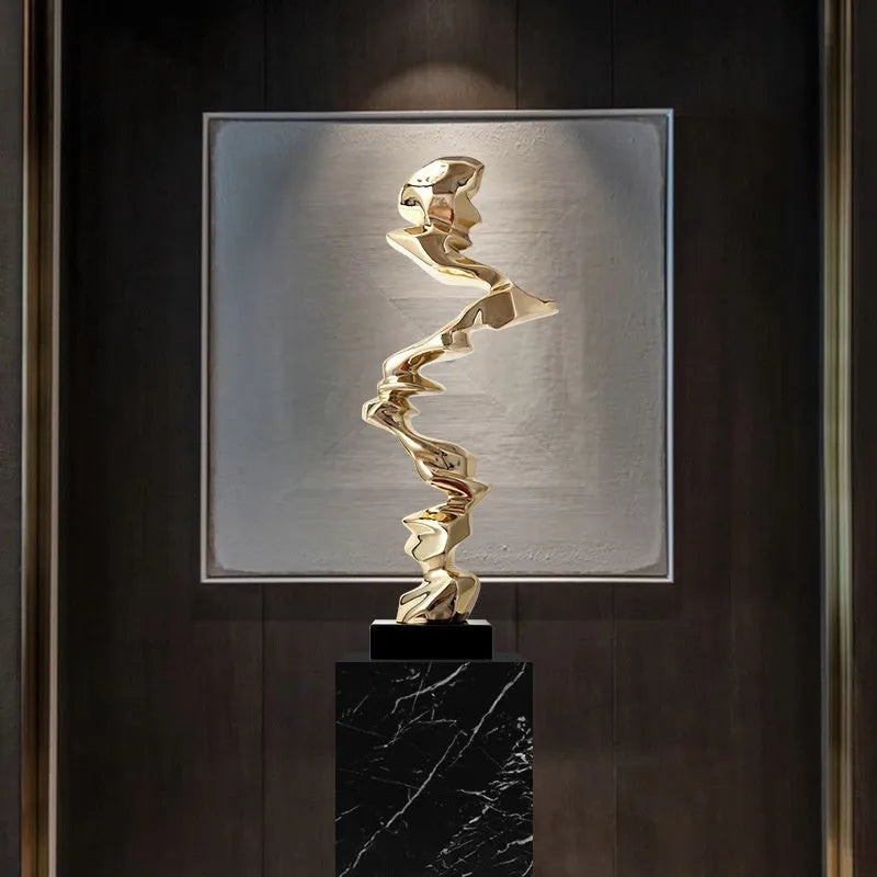Minimalist abstract resin decorative sculpture in bright gold, silver, or blue.