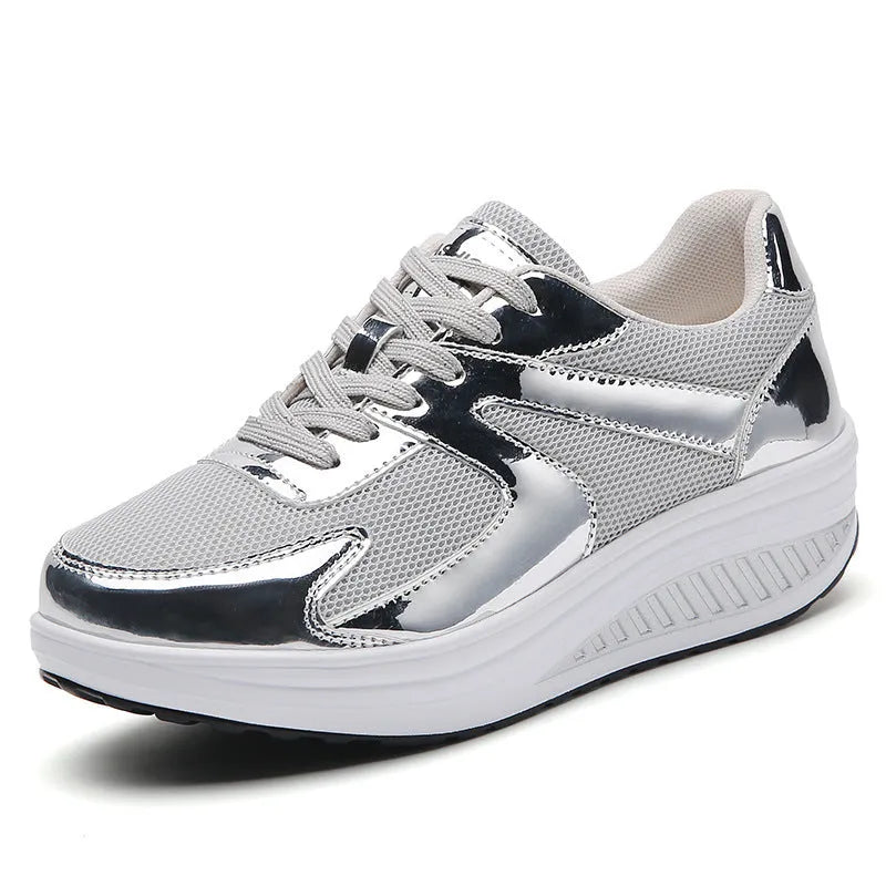 Women's gold platform shoes with mesh upper, round toe, and cross-strap detail