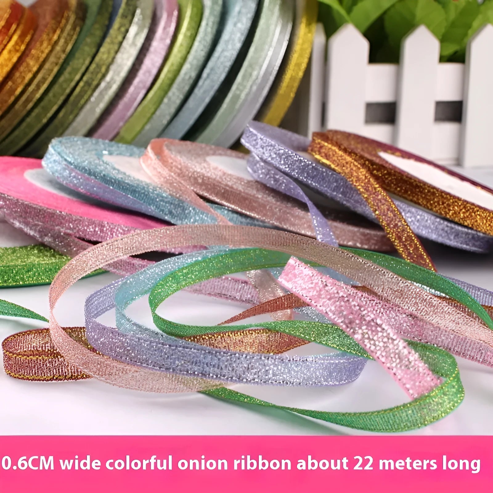 Roll of polyester gift ribbon showing 0.6cm width and multiple colour options including metallic finishes