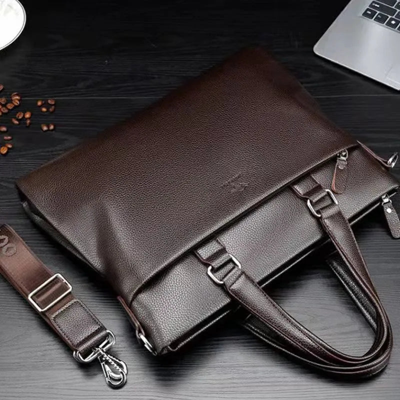 Men's black PU leather messenger bag with crossbody strap showing splicing design detail
