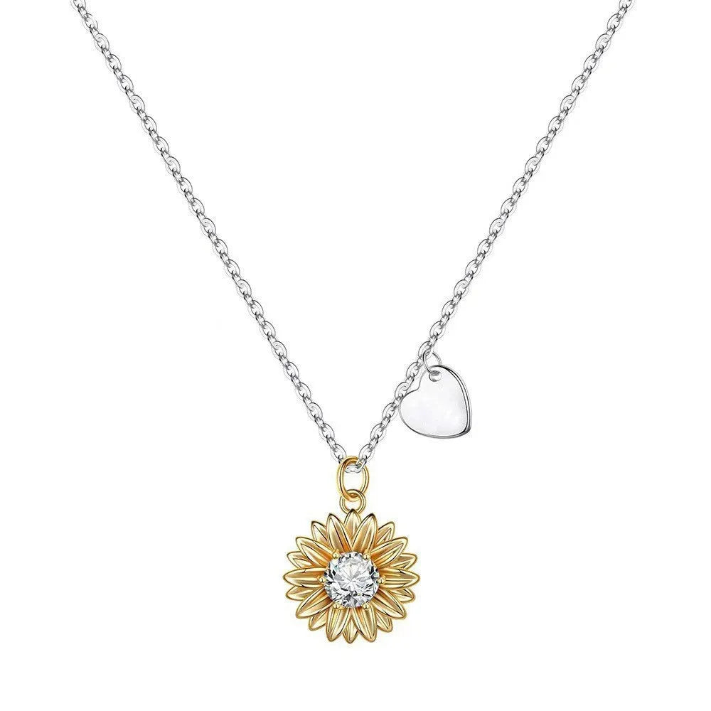Sterling silver sunflower necklace with adjustable chain on white background
