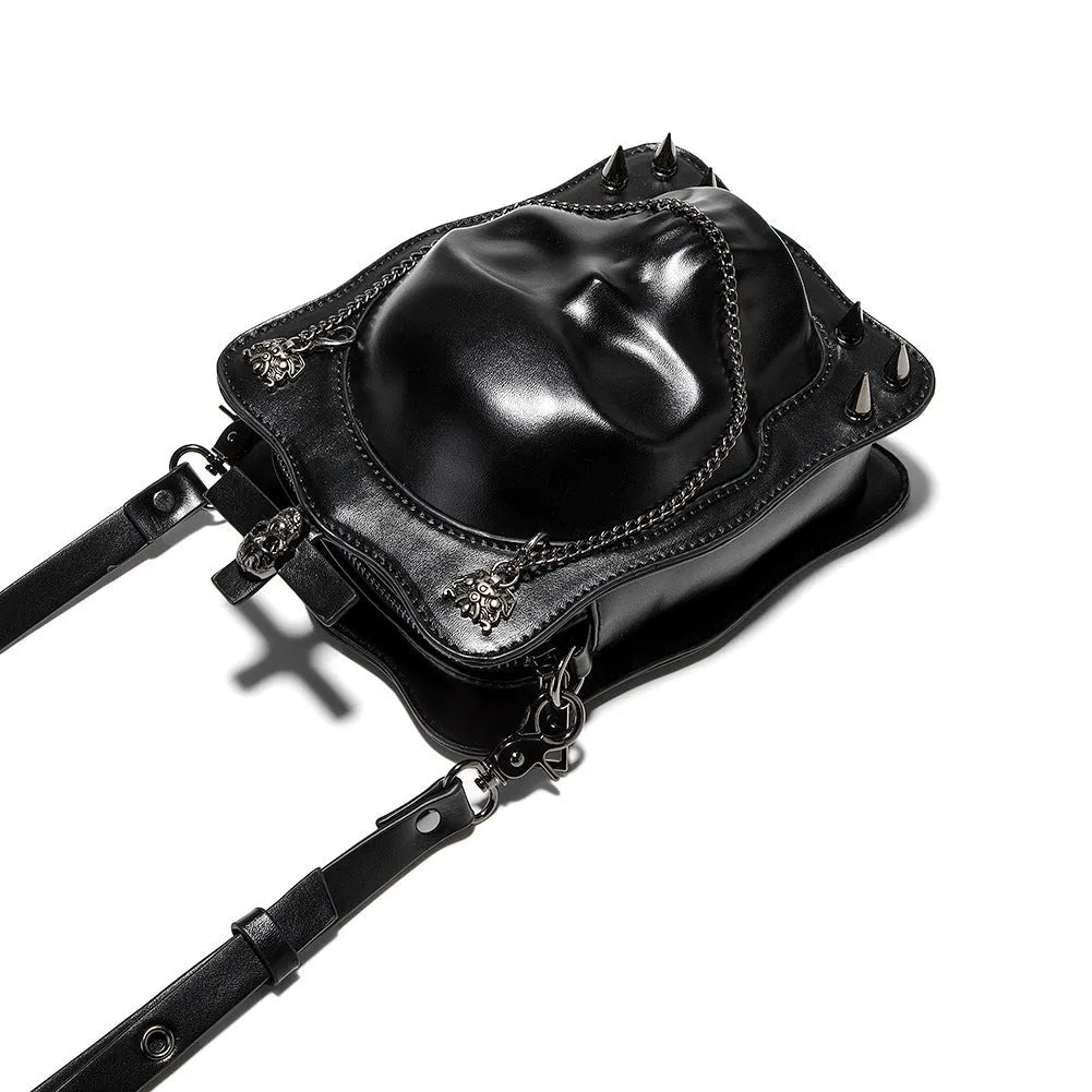 Black gothic skull crossbody bag with square shape, stitching and metal rivet detailing