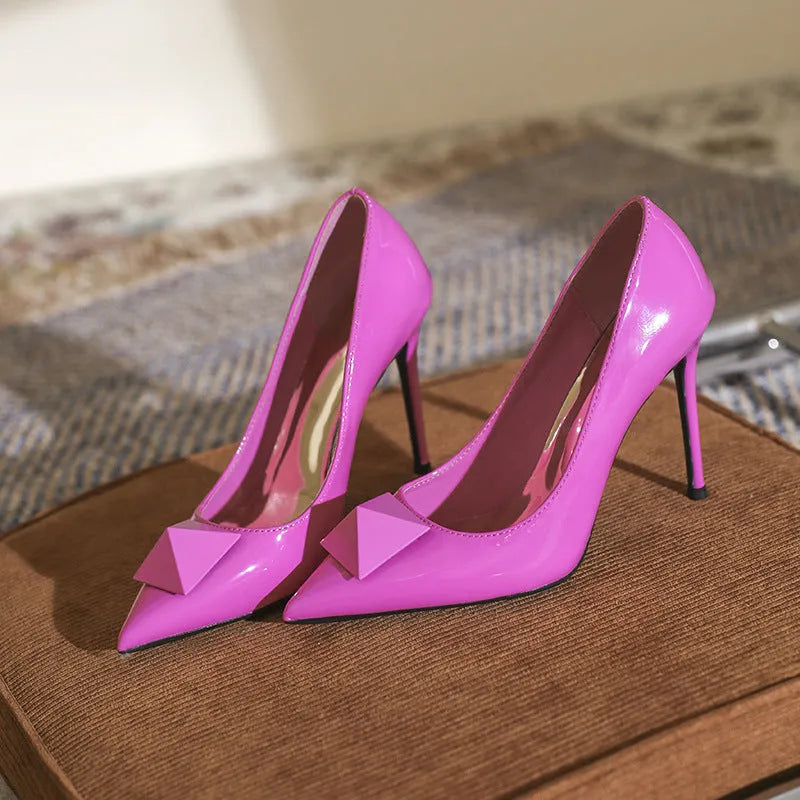 Women's pink pointed toe stiletto high heels with buckle closure and patent leather uppers