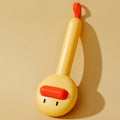 Small yellow duck-shaped pet grooming comb with open section and floating needles