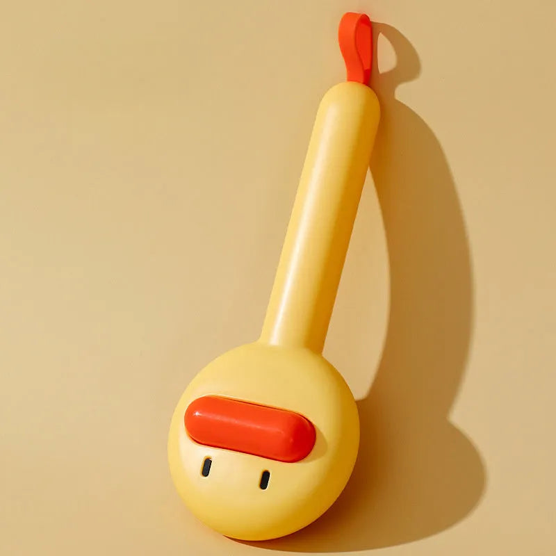 Small yellow duck-shaped pet grooming comb with open section and floating needles
