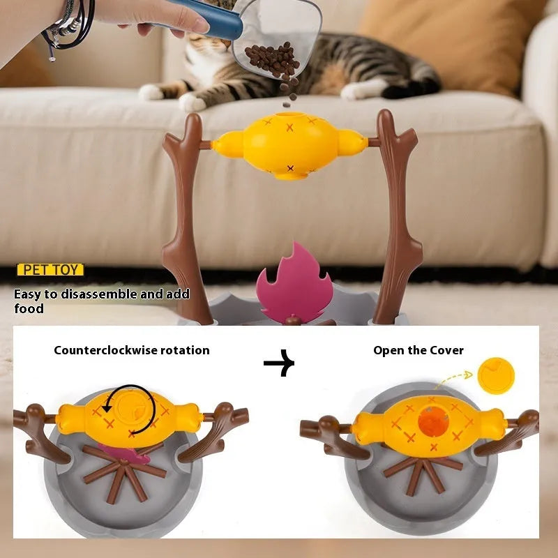 White and grey tumbling cat feeder toy with treat compartment on a wooden floor.
