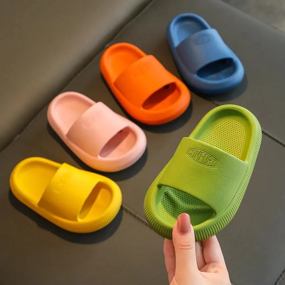 Children's non-slip EVA slippers in bright colours, showing the 1.5cm thick sole.
