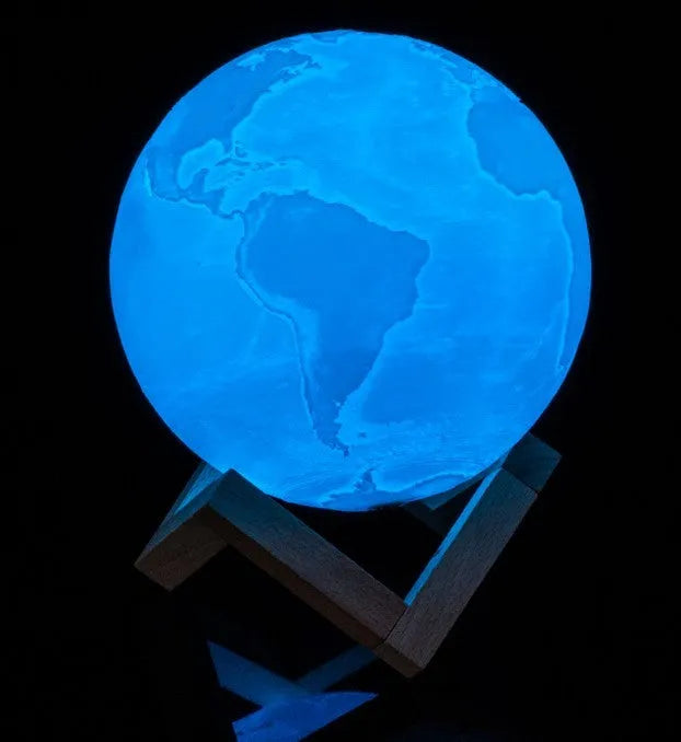 3D printed white moon lamp on wooden stand with touch metal ring at base