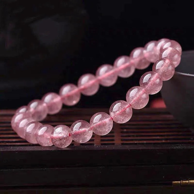 Women's strawberry quartz crystal bracelet with polished beads in three size options