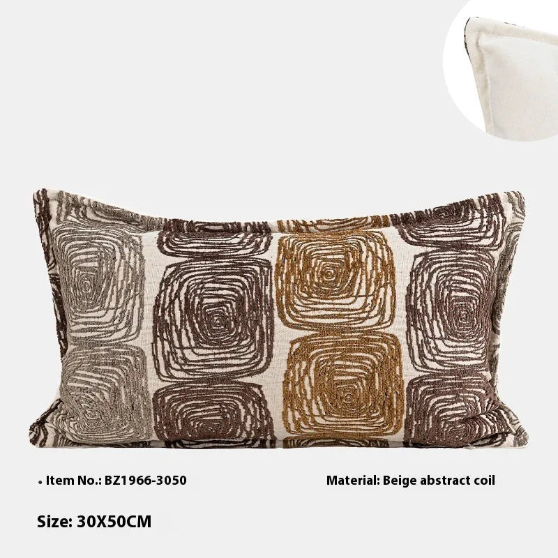 Abstract geometric coil pattern pillow cover in cream and coffee colours on textured fabric