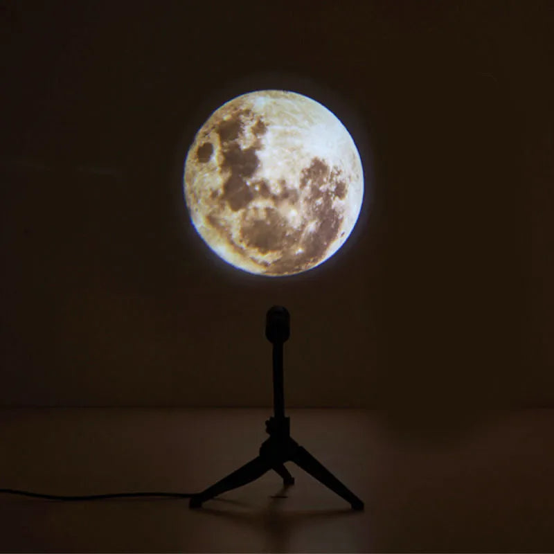 Earth and moon projection lamp with adjustable hose bracket on wooden surface