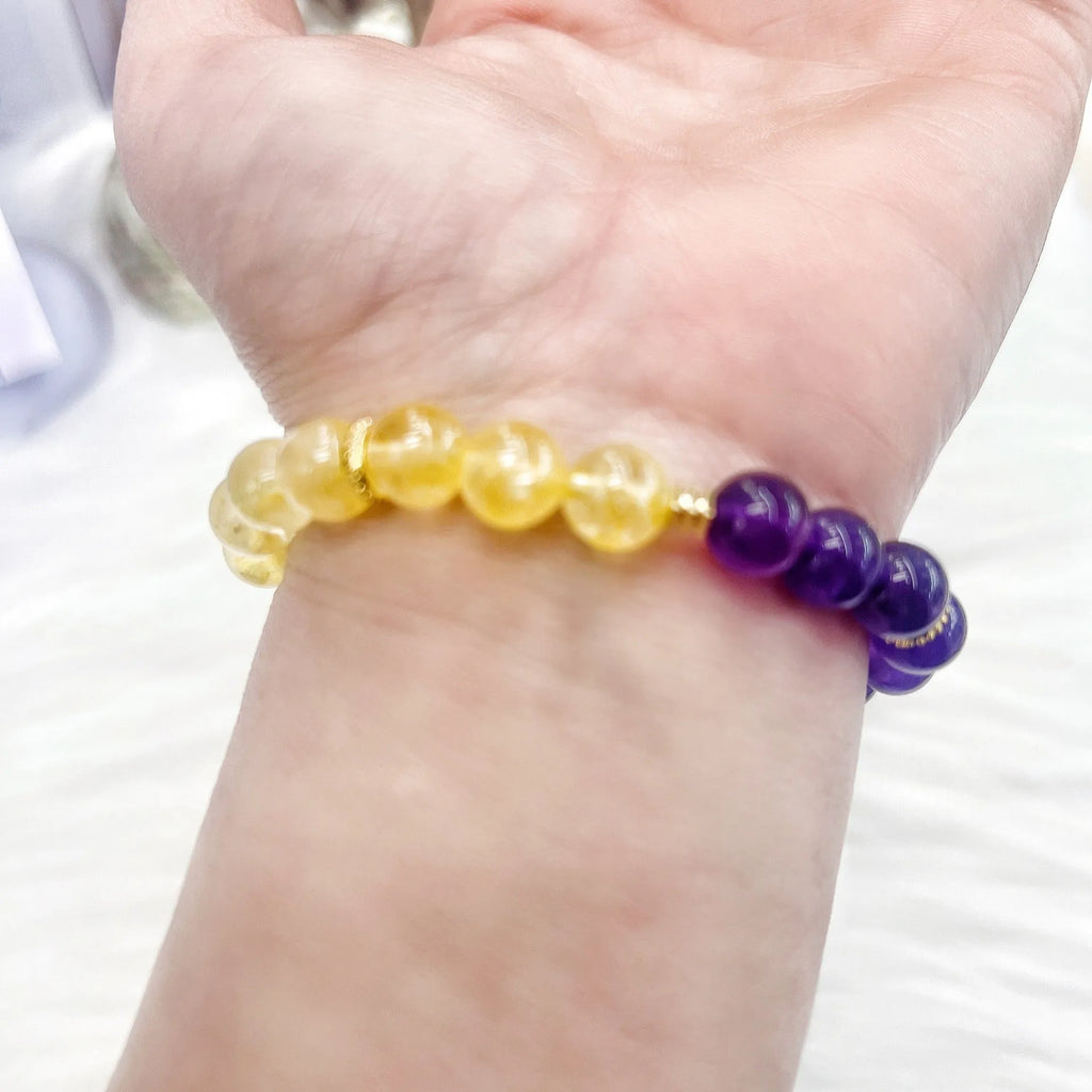 Handmade women's crystal bracelet with yellow and purple amethyst stones