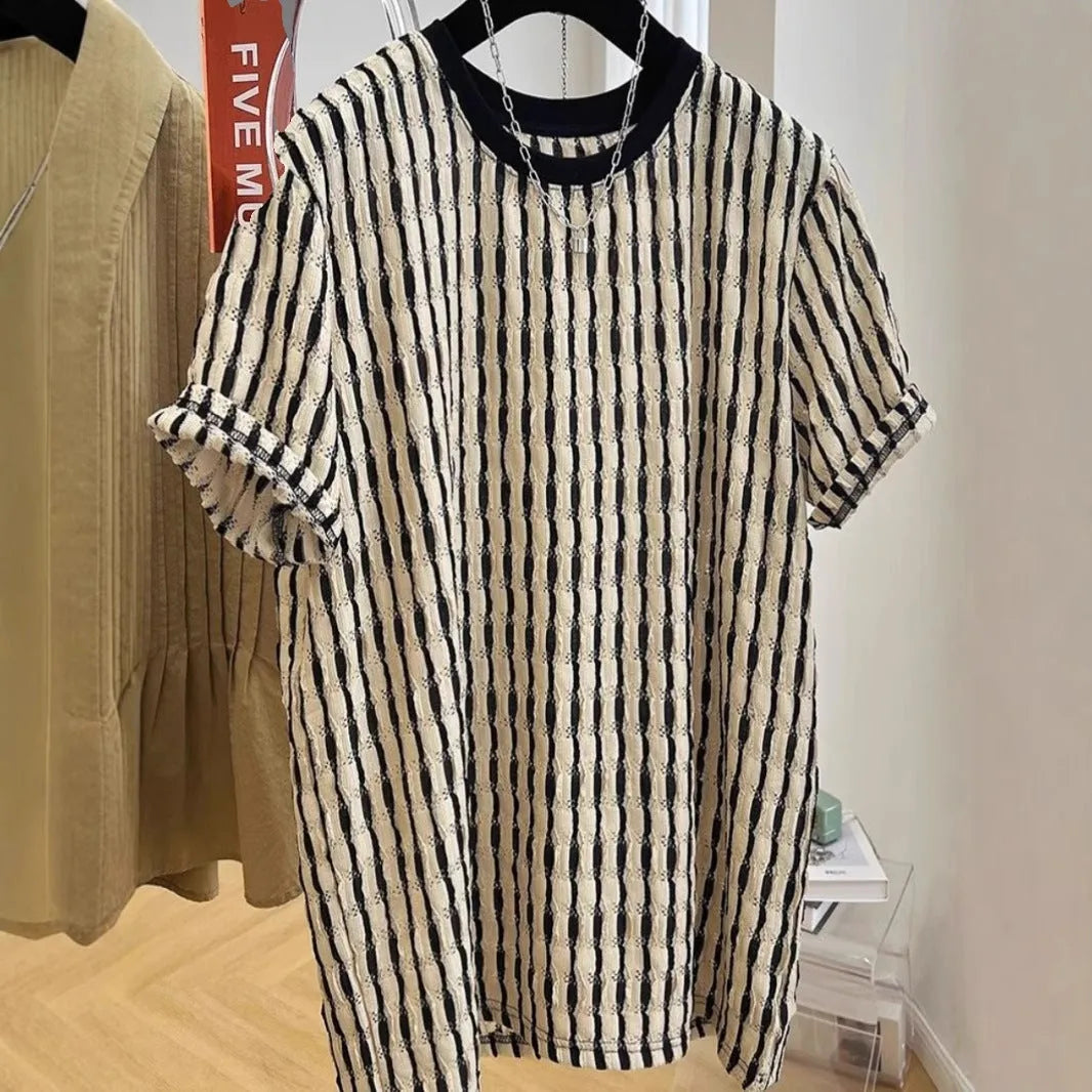 Black striped men's loose fit casual short sleeve pullover shirt on a hanger.