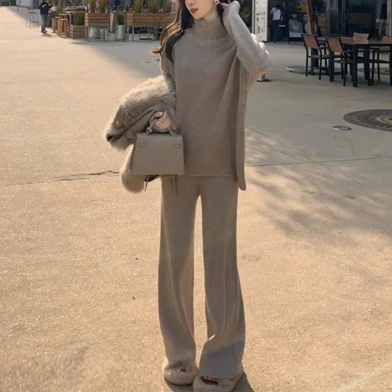 Women's solid colour sweater and wide leg trousers two-piece set in beige, shown as a coordinated outfit.