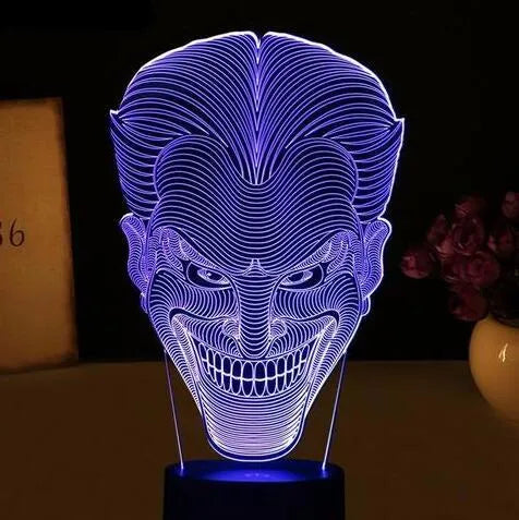 3D acrylic LED lamp on a base showing multi-colour gradient lighting, with a USB cable and remote control.
