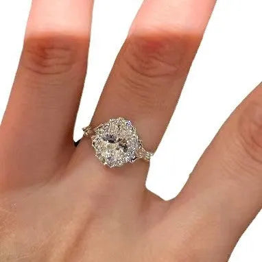 Silver geometric bridal bouquet ring with adjustable opening and diamond-treated elliptical element
