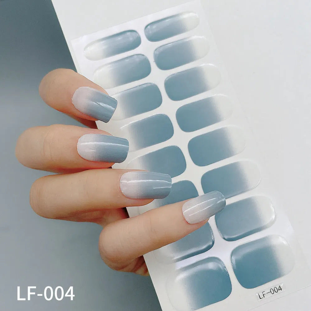 Sheet of 16 solid colour nail art sticker designs including cross, rose, and leopard print patterns.