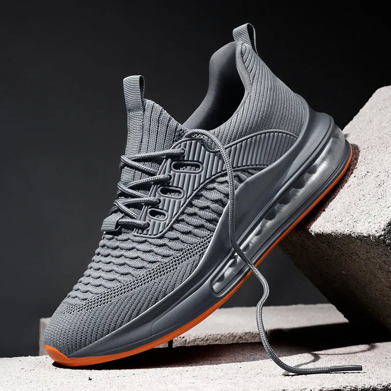 Men's low-top black mesh running sneakers with a round toe and lace-up front on a rubber sole.