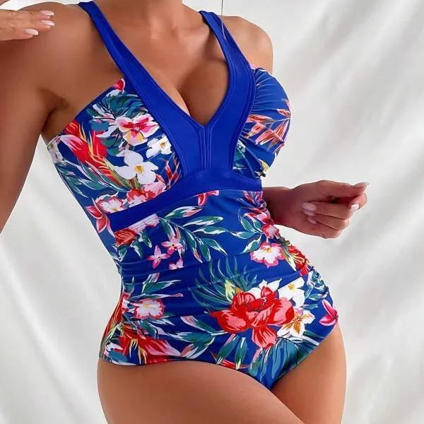 Backless floral one-piece swimsuit for women in a high-stretch polyester-spandex fabric.