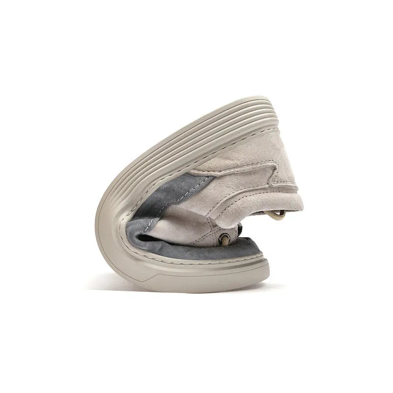 Men's gray casual skate shoes with pigskin leather upper and rubber sole on a white background.