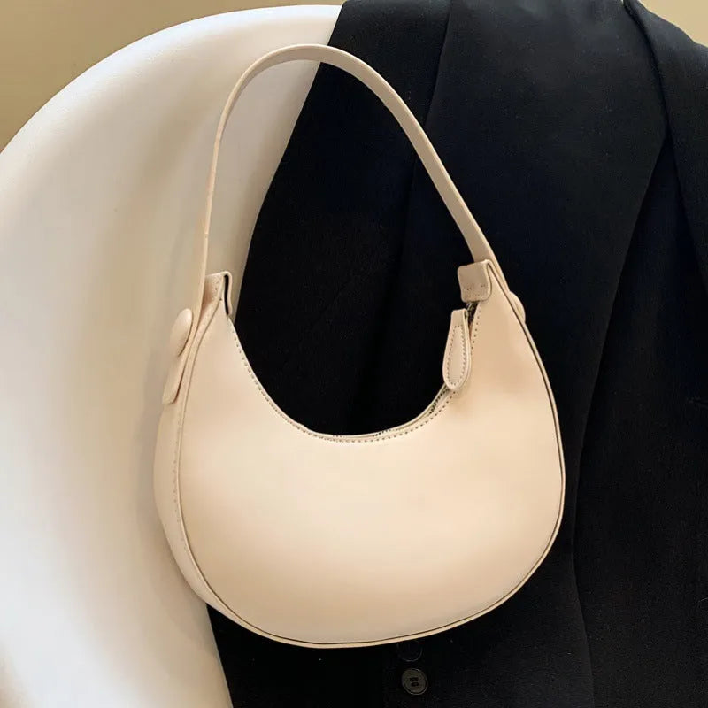 Retro dumpling-shaped women's shoulder bag in PU leather with sandwich pocket exterior