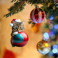 Christmas-themed cartoon cat car hanging ornament made of clear acrylic, shown in one of ten colour variants.