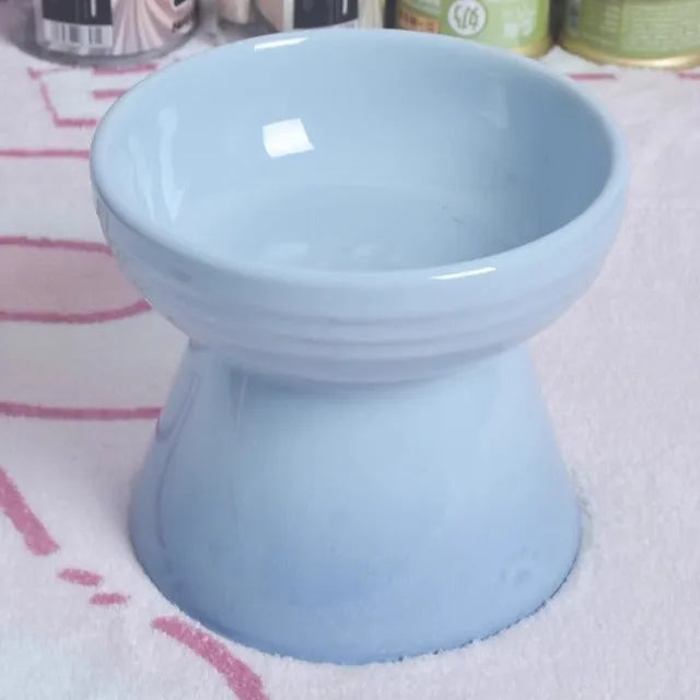 Ceramic pet bowl with anti-tumble design and raised chin support for cats and dogs