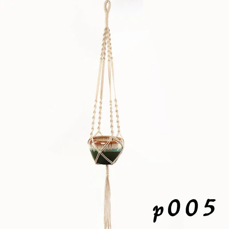 Woven cotton rope plant holder in a desktop style with greenery inside.