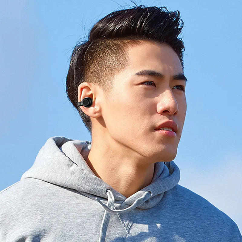 Black wireless Bluetooth clip-on headset with bone conduction technology for exercise