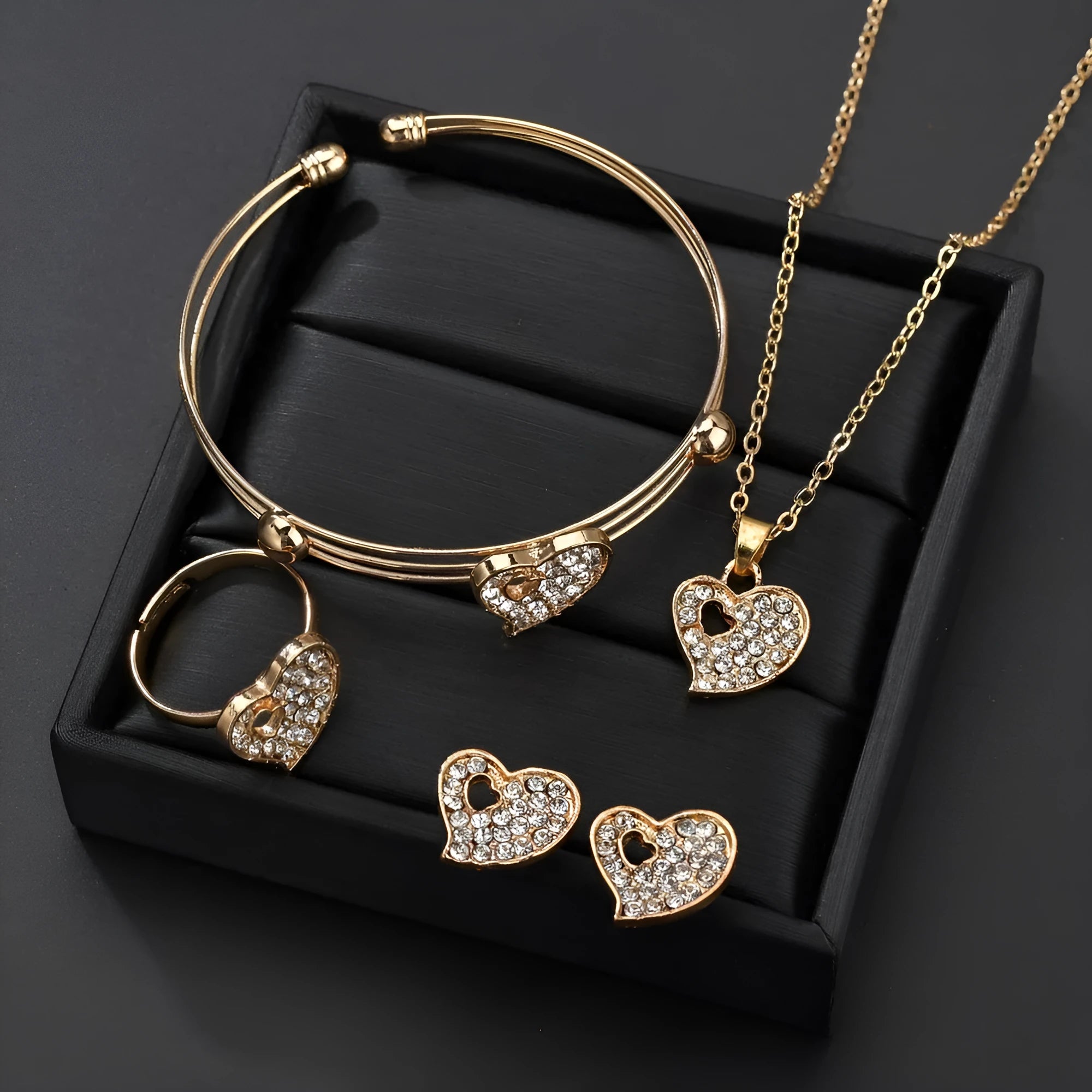 Women's gold electroplated alloy jewellery set with adjustable necklace, earrings, and bracelet