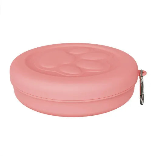 Collapsible silicone dog bowl in light pink and green colours showing portable feeding design
