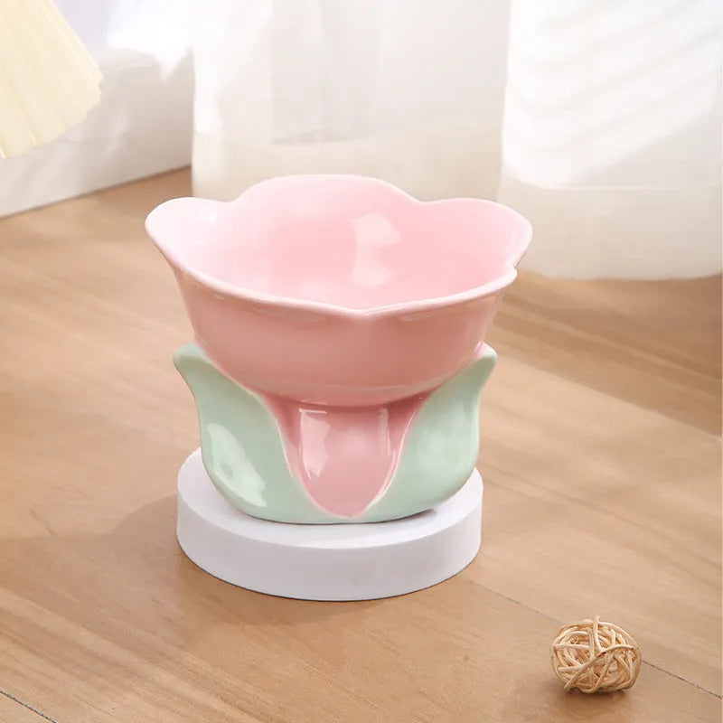 Blue ceramic elevated pet bowl with floral pattern for cats and small dogs on a non-slip base.