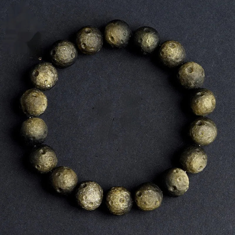 Natural crater ball bracelet featuring gold obsidian and silver stone meteorite beads in various sizes from 9mm to 16mm
