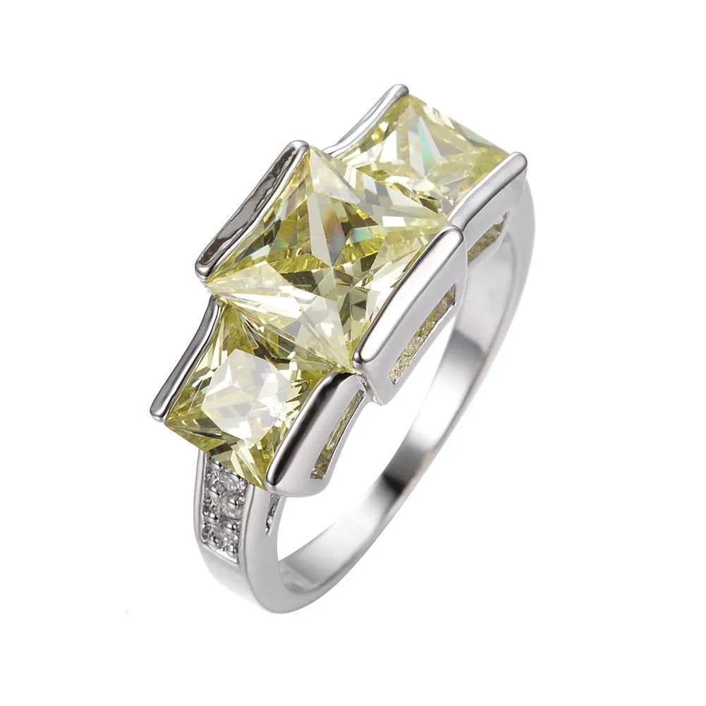 Women's geometric rainbow metal ring in electroplated copper showing colour options.