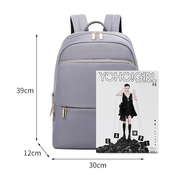 Large capacity black Oxford cloth women's backpack with shoulder straps.