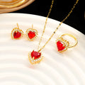 Gold red titanium steel heart jewellery set with gemstone inlay, showing necklace, earrings, and ring.
