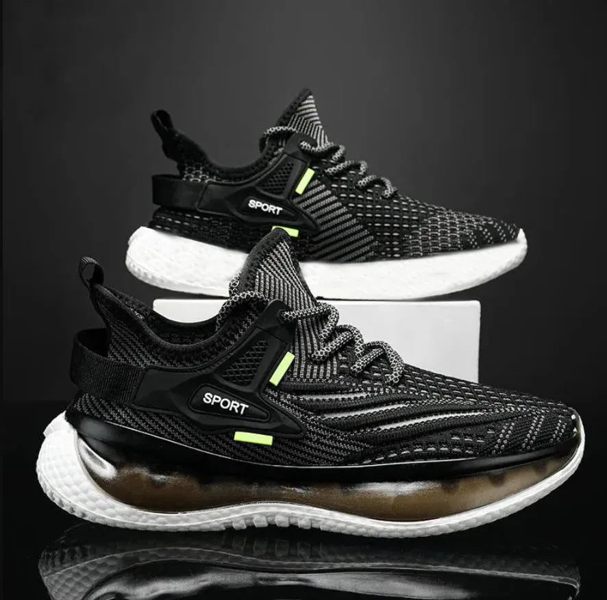 Men's low-top white mesh sneakers with a rubber sole and round toe on a plain background.