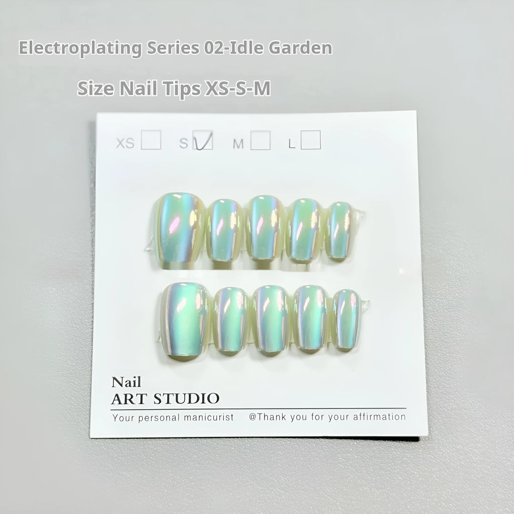 Electroplated Cat's Eye false nail set showing Aurora, solid colour, and gemstone-effect styles in short ladder sizes.